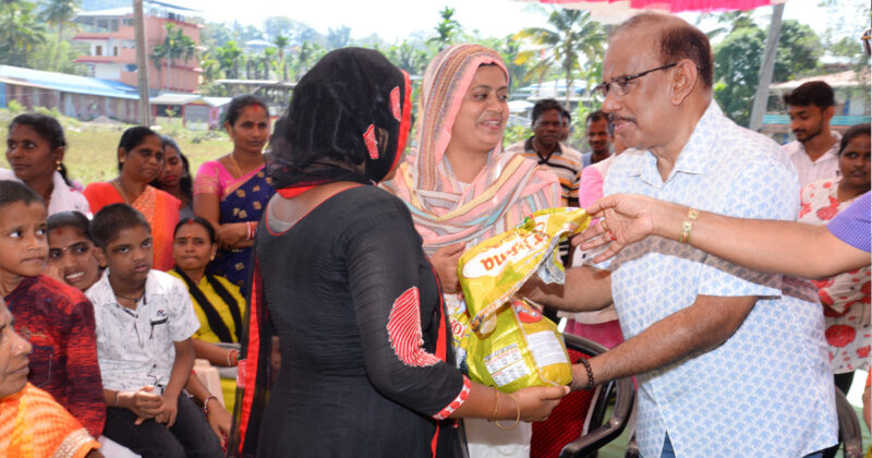 Mariam Bibi, Zilla Parishad Member in South Andaman, and Sagar Daran with Amriteswari Society, Singapore distribute basic supplies to people in Bambooflat.