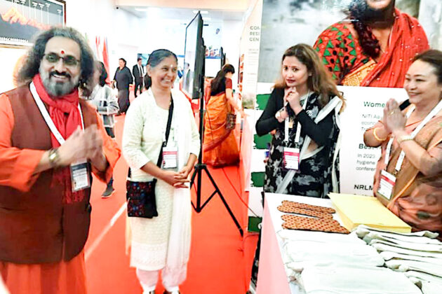 The stall for Saukhyam at the C20 Conclave for Sustainable & Resilient Communities. Swami Amritaswarupananda Puri is to the left and Ms Anju Bist, Managing Director of Saukhyam, is centre.